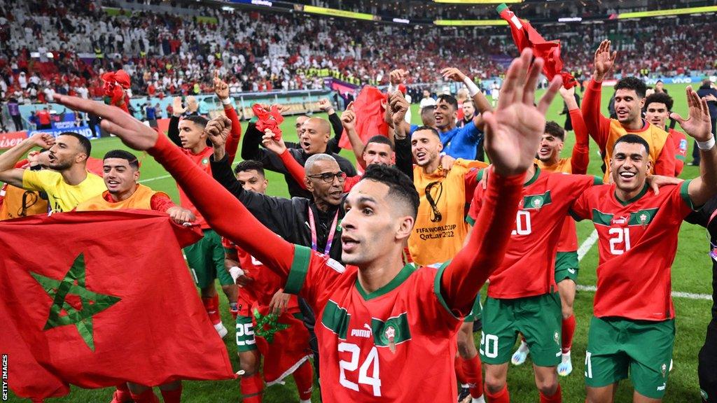 Morocco players celebrate beating Portugal in the quarter-finals of the 2022 World Cup in Qatar