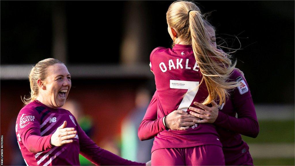 Cardiff City players celebrate Molly Kehoe's goal against Swansea City