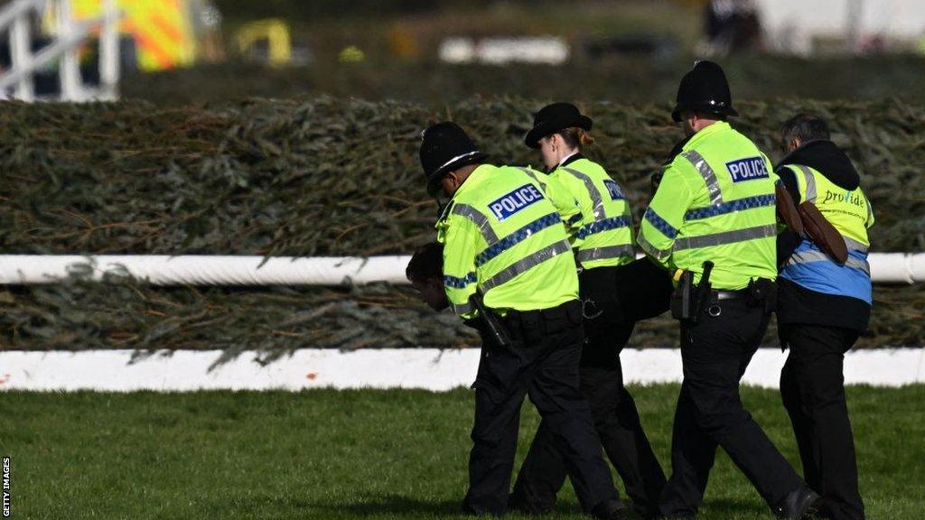 Police arrested protesters at the 2023 Grand National