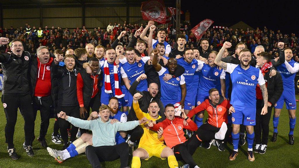 Larne celebrate winning the league title