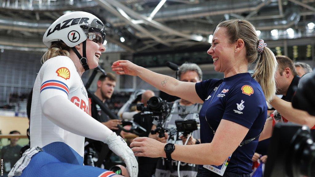 Emma Finucane hugs Kaarle McCulloch after winning World Championship gold