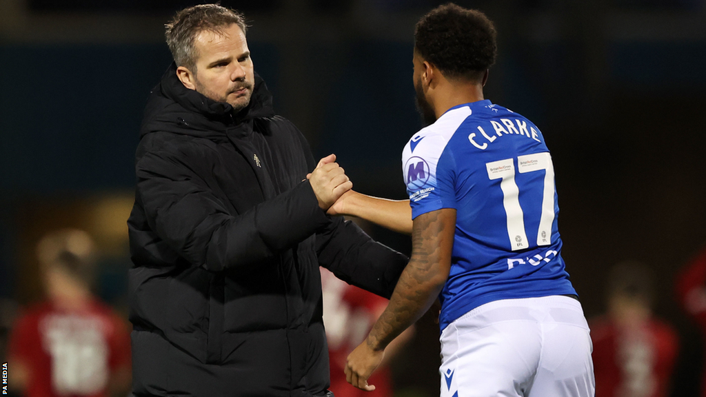 Gillingham boss Stephen Clemence congratulates Jayden Clarke after victory over Salford