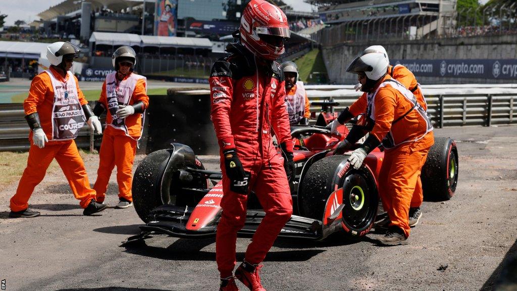 Ferrari's Charles Leclerc walks away from his car after crashing on the formation lap of the Sao Paulo Grand Prix