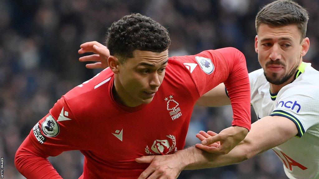 Brennan Johnson of Nottingham Forest competes for possession with Clement Lenglet of Tottenham Hotspur