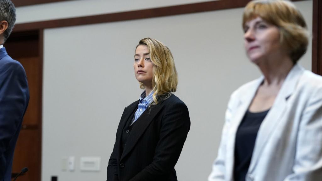 Actor Amber Heard (C) stands in courtroom with her legal team at Fairfax County Circuit Court during a defamation case against her by ex-husband, actor Johnny Depp, in Fairfax, Virginia, USA, 04 May 2022.