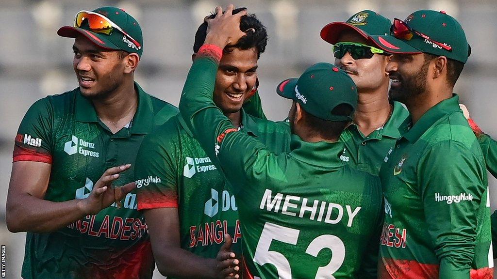 Hasan Mahmud is congratulated by Bangladesh team-mates after taking one of his first Irish wickets