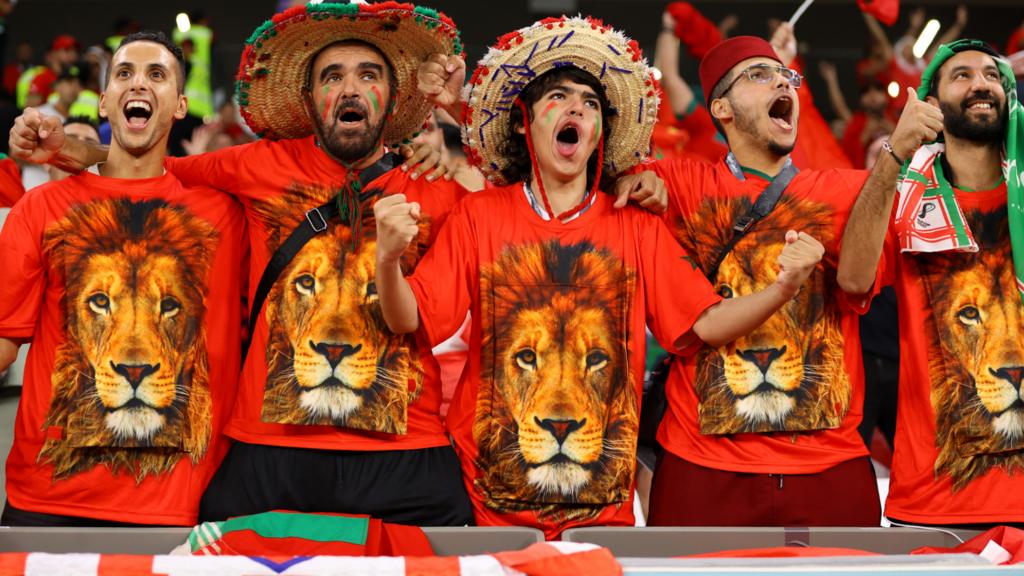 Morocco fans celebrate their penalty shoot out win against Spain