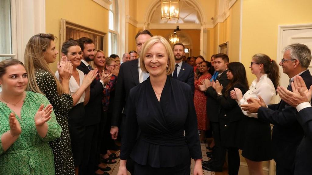 Liz Truss applauded as she enters No 10