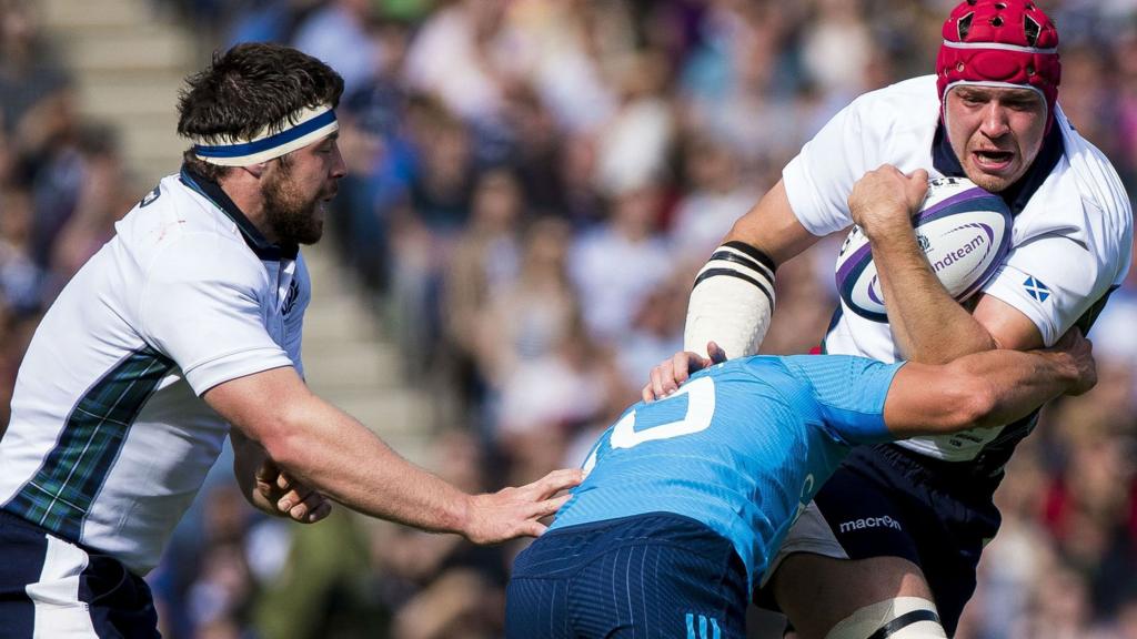 Grant Gilchrist is tackled by Tommaso Allan