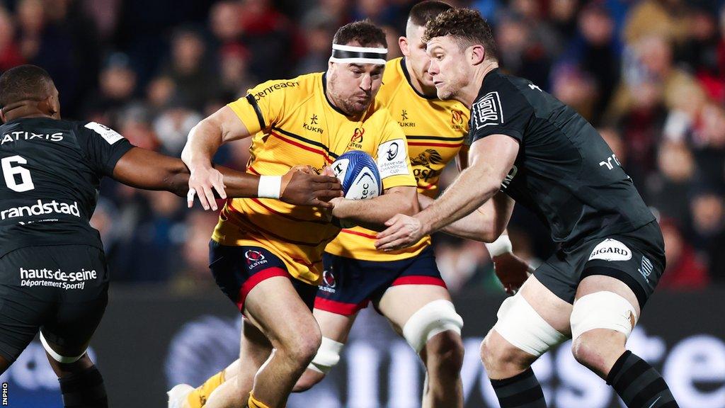 Rob Herring is tackled by Cameron Woki and Will Rowlands during Ulster's win over Racing 92