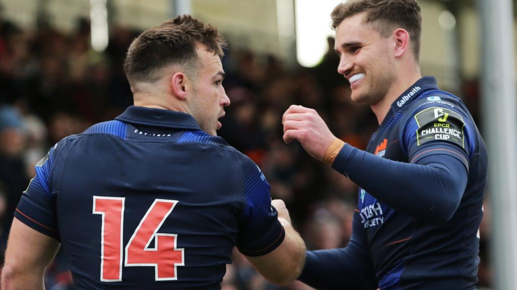 Edinburgh's Wes Goosen (no. 14) celebrates with James Lang