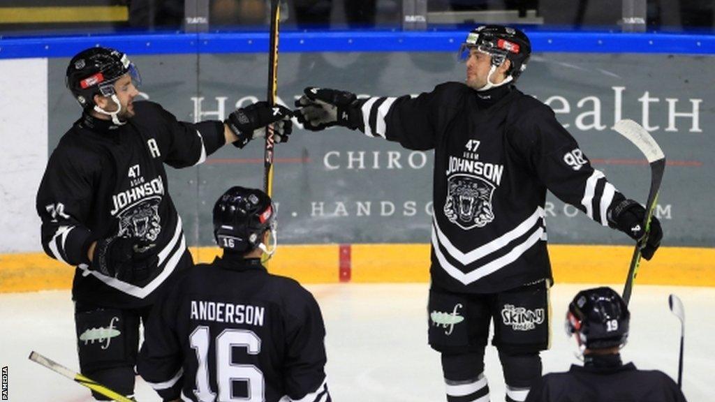 Didrik Henbrant celebrates scoring the Nottingham Panthers' third goal during the Adam Johnson Memorial Game in Nottingham