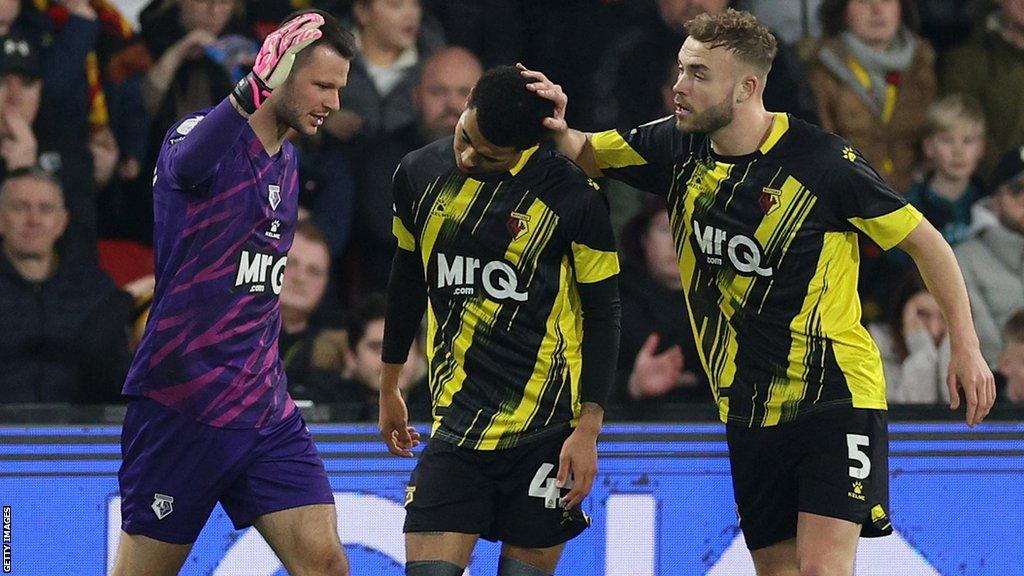 Goalkeeper Daniel Bachmann (left) and Ryan Porteous (right) console Ryan Andrews (centre) after his own goal