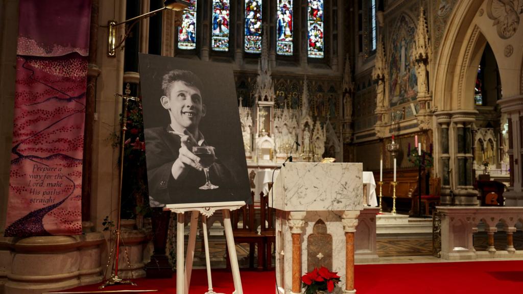 A picture of late Irish singer Shane MacGowan is displayed on the day of his funeral procession, in Tipperary, Ireland, 8 December 2023.