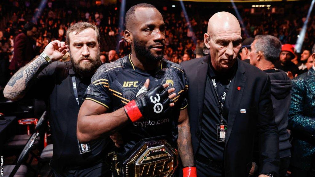 Leon Edwards celebrates beating Colby Covington at UFC 296