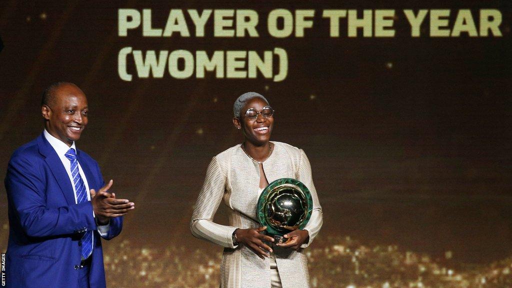 Asisat Oshoala (right) and Patrice Motsepe