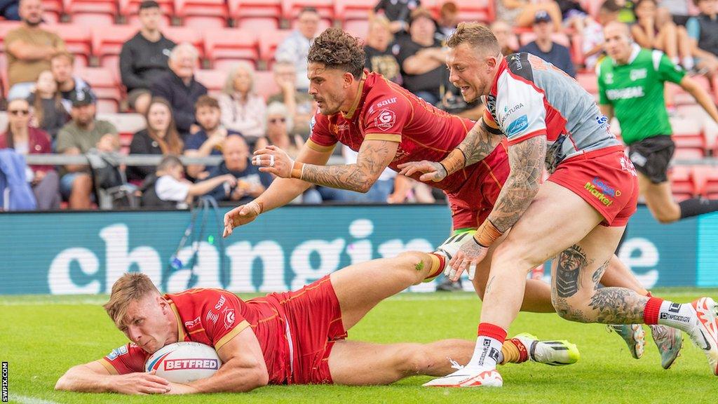 Tom Davies touches down to score a try for Catalans Dragons