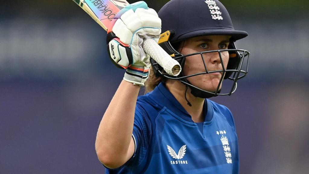 England batter Nat Sciver-Brunt raises her bat after being dismissed for 120