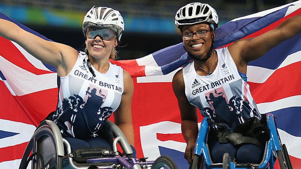 Hannah Cockroft (L) and Kare Adenegan (R) of Great Britain celebrate winning the gold and bronze in the Women's T34 4oom final