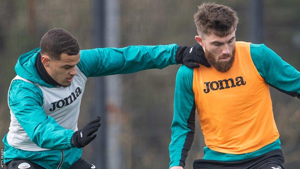 Joel Latibeaudiere and Ryan Manning in training