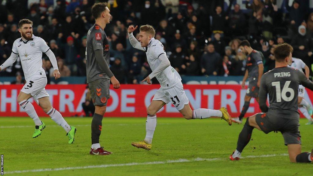 Ollie Cooper celebrates his sixth goal of the season