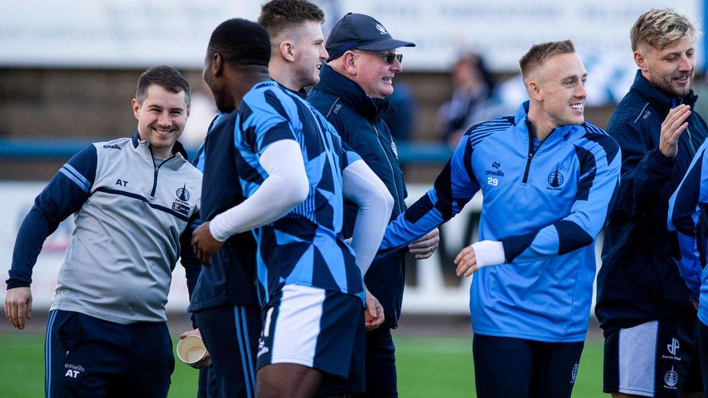 Falkirk players and manager John McGlynn celebrate their League One title win pre-match