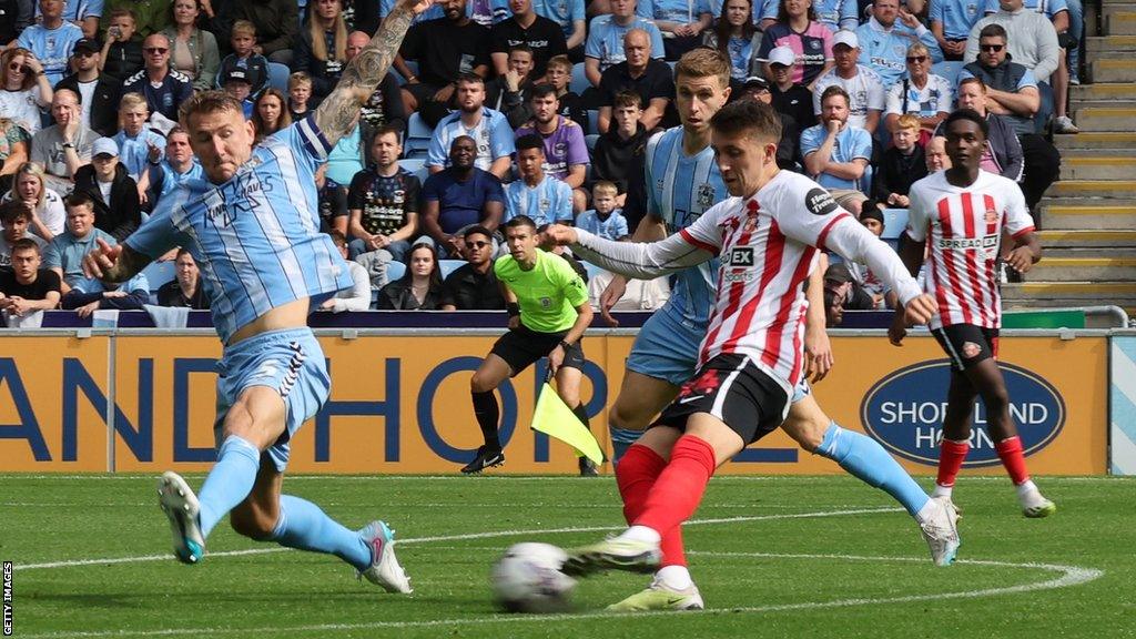 Dan Neil shoots for Sunderland but it is saved