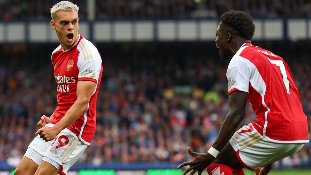 Leandro Trossard (left) celebrates scoring