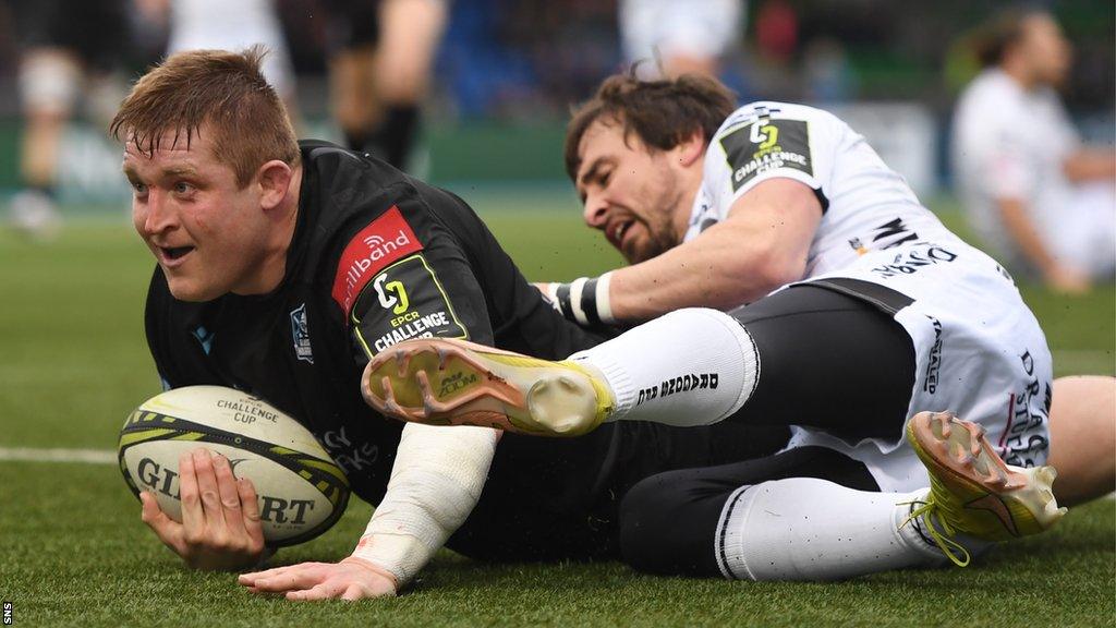 Glasgow Warriors' Johnny Matthews (left) scores