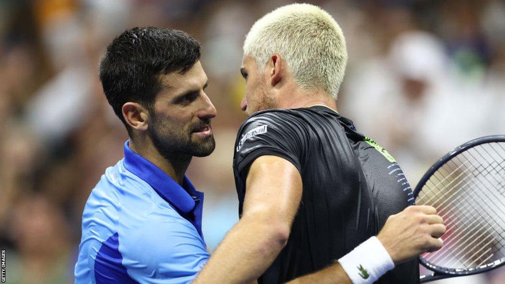 Novak Djokovic hugs Borna Gojo after their US Open match