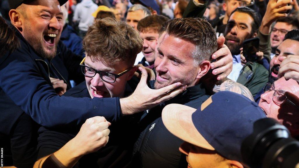 Rob Edwards celebrate with Luton fans