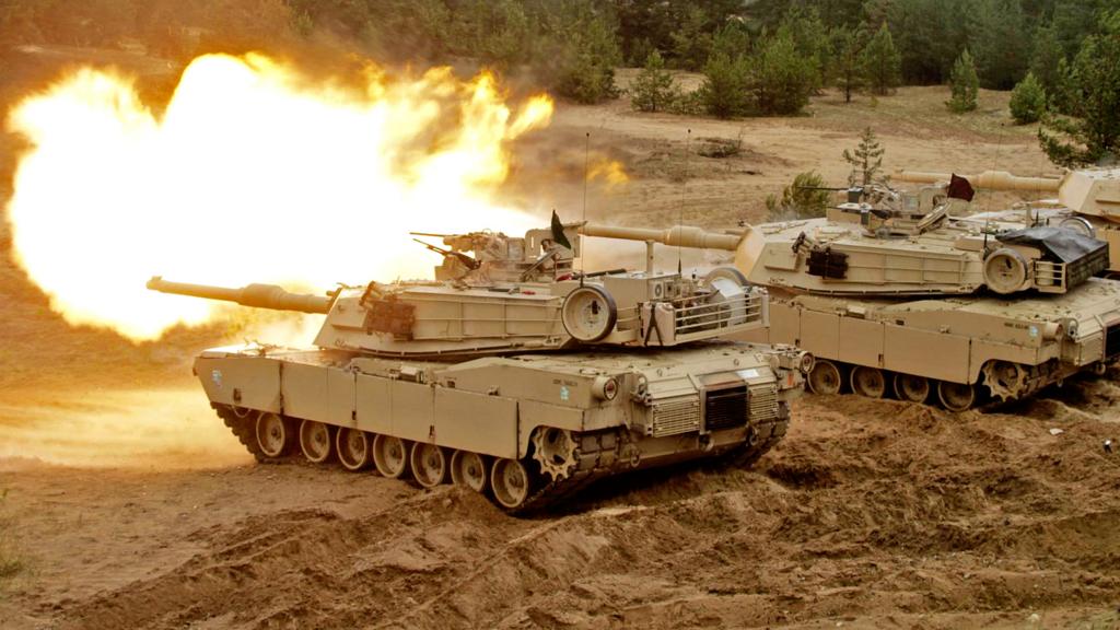 A US Army Abrams tank fires during the Saber Strike military exercises in Adazi military training area, Latvia, 11 June 2016