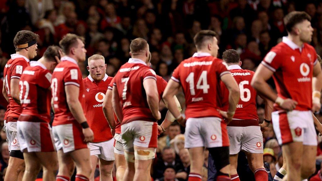 Wales players look dejected after their loss to Scotland