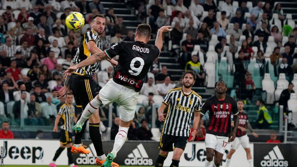 Olivier Giroud scores a header for AC Milan against Juventus