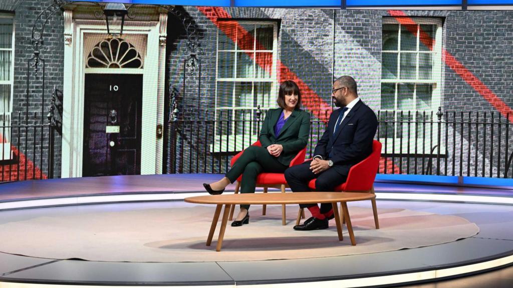 Rachel Reeves and James Cleverly sit side by side in a studio.