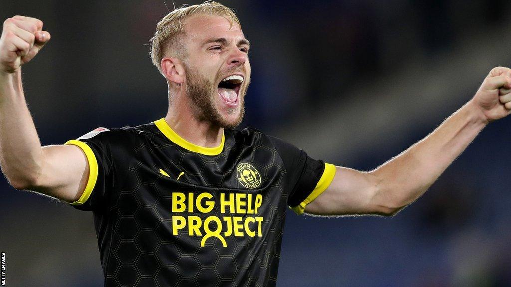 Jack Whatmough celebrates a win for Wigan Athletic