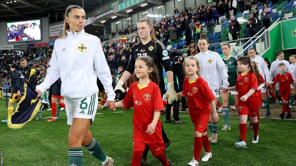 Laura Rafferty leads out Northern Ireland at Windsor Park