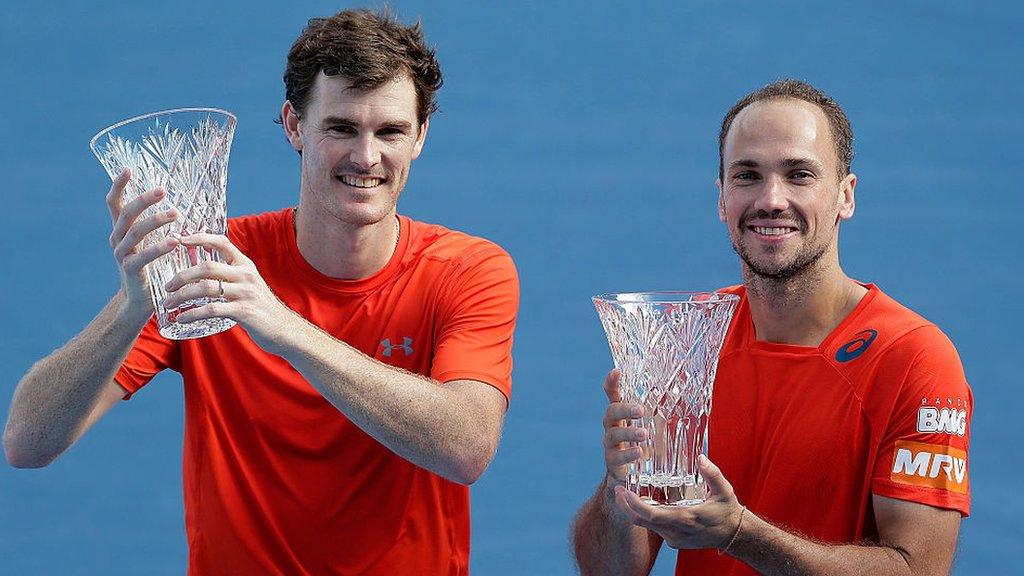 Jamie Murray and Bruno Soares with their Apia International in Sydney trophies