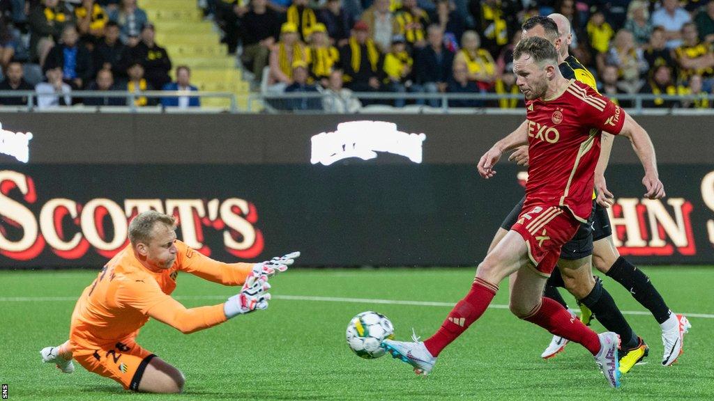 Nicky Devlin lifts in Aberdeen's leveller in Gothenburg