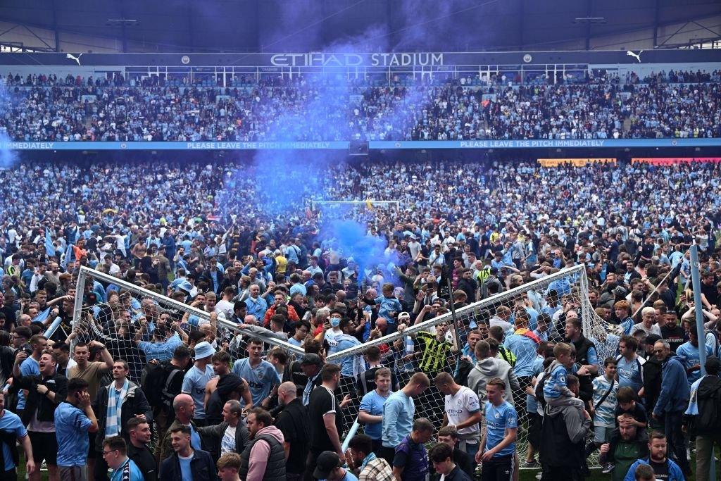 A general view as fans of Manchester City invade the pitch after winning the Premier League during the Premier League match between Manchester City and Aston Villa at Etihad Stadium