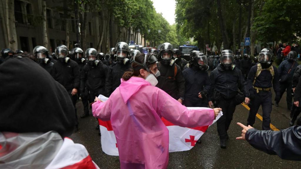 Protester and police in Tbilisi