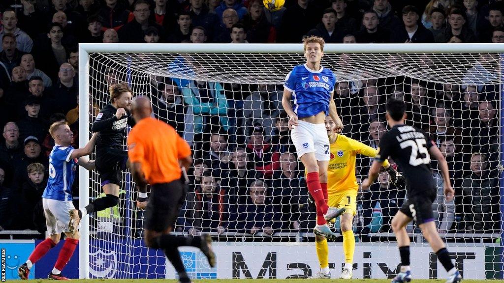 Sean Raggett heads clear