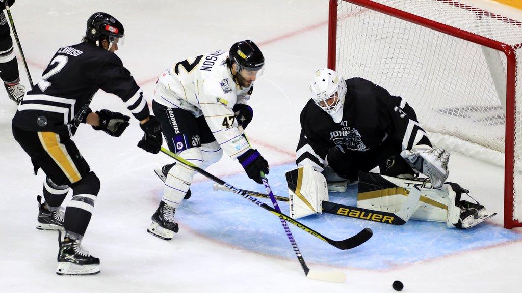 Nottingham Panthers' Michael Caruso and Manchester Storm's Stephen Johnson battle for the puck during the Adam Johnson Memorial Game