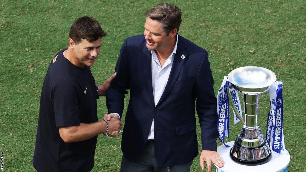 Mauricio Pochettino, Manager of Chelsea, interacts with Richard Masters, CEO of Premier League with the Summer Series trophy