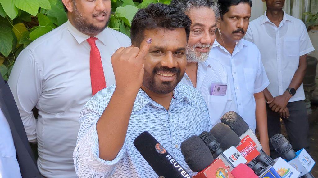 Anura Kumara Dissanayake shows his finger marked with indelible ink