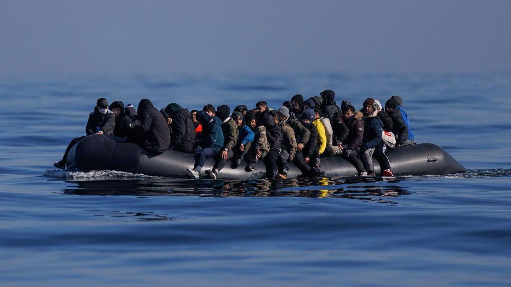 An inflatable carrying dozens of migrants in the Channel 