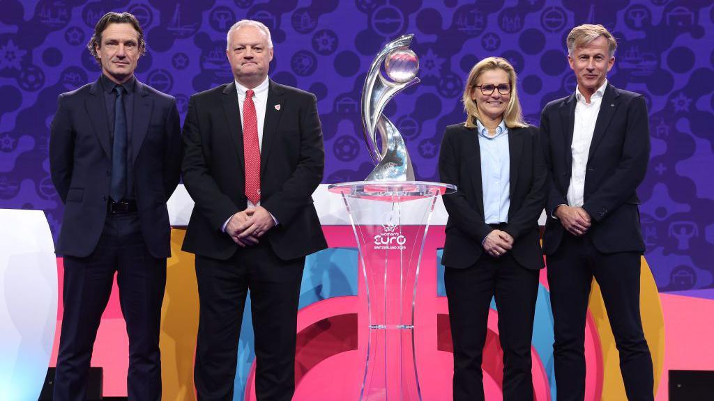 Andries Jonker and Sarina Wiegman on stage together at the Euro 2025 draw