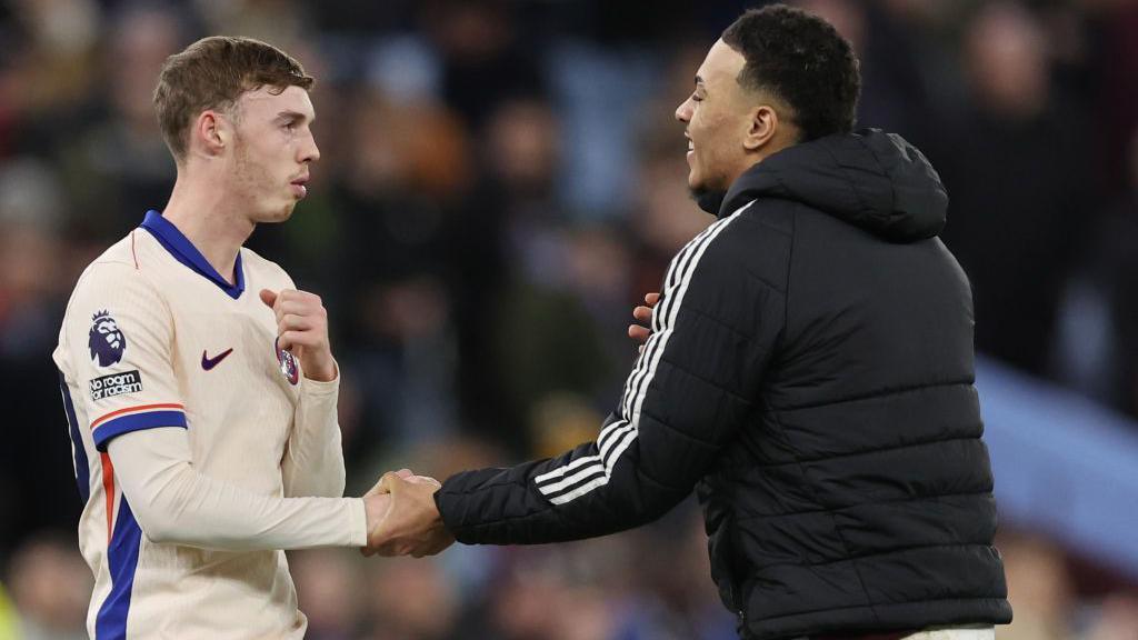 Morgan Rogers shakes the hand of Cole Palmer after a Premier League match