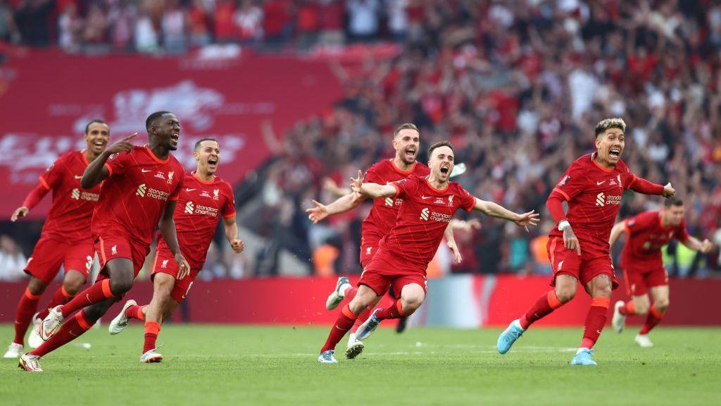 Ibrahima Konate, Diogo Jota and Roberto Firmino of Liverpool celebrate after victory against Chelsea in the 2022 FA Cup final