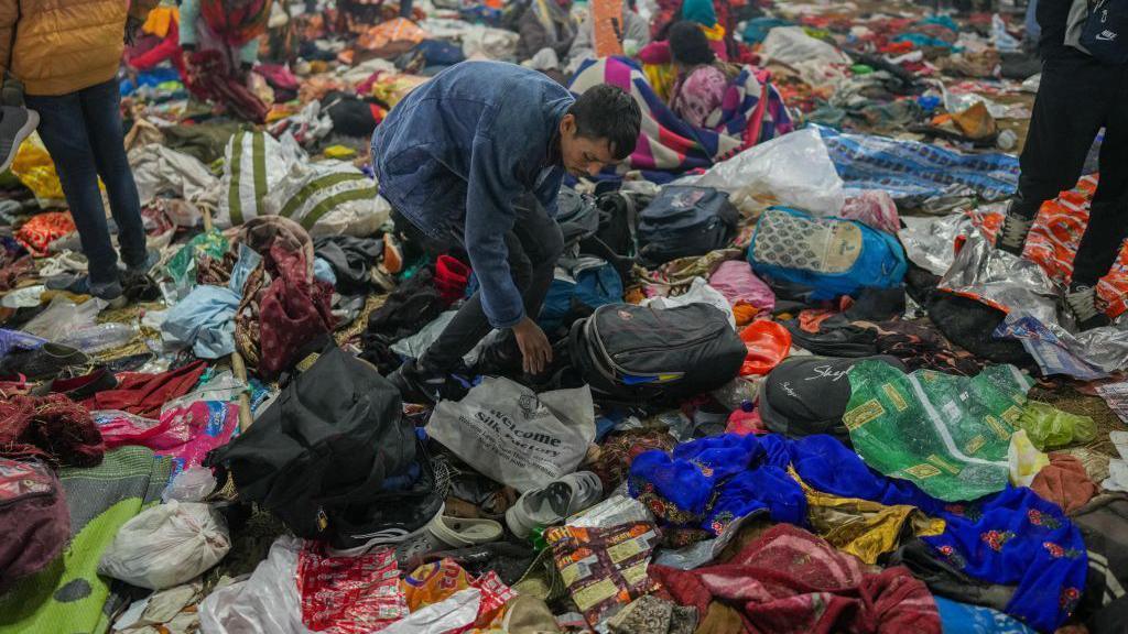 PRAYAGRAJ, INDIA - JANUARY 29: Hindu pilgrims look for their belongings at the site of a stampede amid the ongoing Maha Kumbh Kumbh Mela festival in Prayagraj, India on January 29, 2025. Many people are feared dead after a stampede at the Maha Kumbh Mela, a Hindu festival being touted as the world's largest religious congregation, which kicked off this month in the northern state of Uttar Pradesh. (Photo by Amarjeet Kumar Singh/Anadolu via Getty Images)